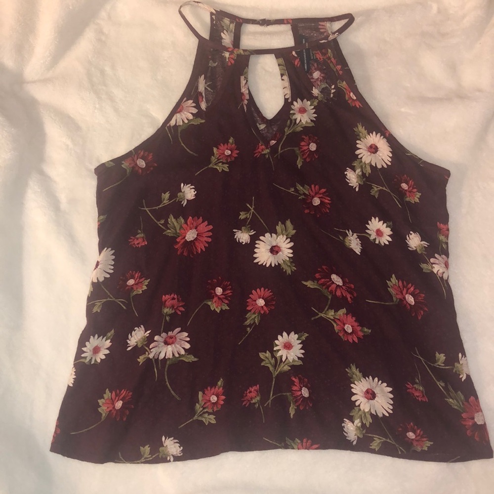 Dress-up blouse with intricate neck design.